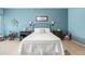 Serene bedroom showcasing a well-lit space, soft carpet, and tastefully decorated walls at 3022 E Santa Fe Ln, Gilbert, AZ 85297