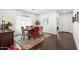 Elegant dining room with wood floors, a decorative rug, and seating for six, perfect for gatherings at 3022 E Santa Fe Ln, Gilbert, AZ 85297
