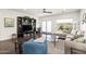 Comfortable living room with hardwood floors, shelving and natural light at 3022 E Santa Fe Ln, Gilbert, AZ 85297
