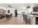 Open concept living space with a kitchen, dining area, and a relaxed seating area for seamless entertaining at 3022 E Santa Fe Ln, Gilbert, AZ 85297