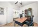 This office features a wooden desk, neutral carpeting, and an open entryway, creating a functional workspace at 3022 E Santa Fe Ln, Gilbert, AZ 85297