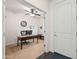 Bright office space with a ceiling fan, natural light, a wooden desk, and built-in storage at 3022 E Santa Fe Ln, Gilbert, AZ 85297