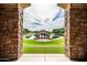 Framed view of a park gazebo on the pond in a beautiful community green space with lush landscaping at 3022 E Santa Fe Ln, Gilbert, AZ 85297