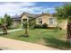 Charming single story home featuring a well-maintained lawn and mature landscaping in a sunny neighborhood at 3116 W Dailey St, Phoenix, AZ 85053