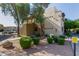 Exterior of condo building with desert landscaping, exterior stairwell, and parking visible at 3434 E Baseline Rd # 126, Phoenix, AZ 85042