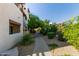 Landscaped walkway to building with lush greenery, desert landscaping, and architectural building details at 3434 E Baseline Rd # 126, Phoenix, AZ 85042