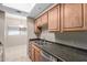 Kitchen featuring stainless steel appliances, stone countertops, and tile flooring at 3434 E Baseline Rd # 126, Phoenix, AZ 85042