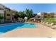 Resort-style pool and hot tub with plenty of seating for lounging and socializing at 3434 E Baseline Rd # 126, Phoenix, AZ 85042