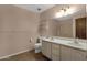 Functional bathroom featuring a dual sink vanity, toilet, and a shower with a curtain at 3537 W Shangri La Rd, Phoenix, AZ 85029