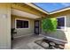 Welcoming home entrance with a decorative tree and a secure screened front door at 3537 W Shangri La Rd, Phoenix, AZ 85029