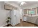 Kitchen with a white refrigerator, a sink and a window with natural lighting at 3537 W Shangri La Rd, Phoenix, AZ 85029