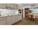 Bright kitchen featuring classic white appliances and plenty of cabinet space at 3537 W Shangri La Rd, Phoenix, AZ 85029