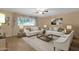 Comfortable living room with plush sofas, elegant décor, and ample natural light at 3537 W Shangri La Rd, Phoenix, AZ 85029