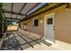 Covered patio featuring a pergola that provides shade, alongside the house's exterior at 3537 W Shangri La Rd, Phoenix, AZ 85029
