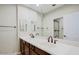 Bathroom featuring a double sink vanity with white countertop and framed mirrors at 3935 E Rough Rider Rd # 1101, Phoenix, AZ 85050