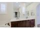 Bathroom featuring double sinks, framed mirrors, wood cabinets, soaking tub at 3935 E Rough Rider Rd # 1101, Phoenix, AZ 85050