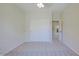 Bedroom featuring neutral carpet, closet with white doors, and access to the hallway at 3935 E Rough Rider Rd # 1101, Phoenix, AZ 85050