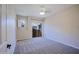 Light-filled bedroom with plush carpet, and a sliding glass door to a private patio at 3935 E Rough Rider Rd # 1101, Phoenix, AZ 85050