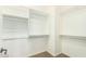 Walk-in closet features built in shelves and hanging racks at 3935 E Rough Rider Rd # 1101, Phoenix, AZ 85050