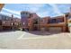 Exterior view of luxury townhomes showing the garages and driveways at 3935 E Rough Rider Rd # 1101, Phoenix, AZ 85050
