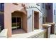 Exterior elevation showcasing private condo entrance and patio with covered entry at 3935 E Rough Rider Rd # 1101, Phoenix, AZ 85050