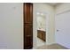 Hallway view showing the linen closet and doorway to the bathroom at 3935 E Rough Rider Rd # 1101, Phoenix, AZ 85050