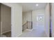 Hallway featuring carpet floors, view of the staircase and doorways to other rooms at 3935 E Rough Rider Rd # 1101, Phoenix, AZ 85050