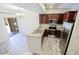 Open-concept kitchen boasts granite countertops, stainless appliances, and modern wood flooring at 3935 E Rough Rider Rd # 1101, Phoenix, AZ 85050