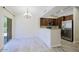 Bright kitchen and dining area with stainless steel appliances and a sliding glass door at 3935 E Rough Rider Rd # 1101, Phoenix, AZ 85050