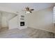 Living space with a corner fireplace and staircase nearby at 3935 E Rough Rider Rd # 1101, Phoenix, AZ 85050