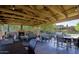 Community covered patio with a fireplace and an outdoor grilling area is perfect for entertaining guests at 3935 E Rough Rider Rd # 1101, Phoenix, AZ 85050
