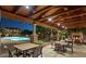 Resort-style pool area with an outdoor fireplace and covered seating offers the perfect community living experience at 3935 E Rough Rider Rd # 1101, Phoenix, AZ 85050