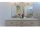 Stylish bathroom featuring marble counters, double mirrors, and a glass-enclosed shower with modern fixtures at 3940 E Heather Ct, Gilbert, AZ 85234