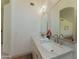 Well-lit bathroom with double sinks, marble countertops, and contemporary fixtures for a modern touch at 3940 E Heather Ct, Gilbert, AZ 85234