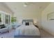 Bright bedroom featuring a plush king bed, neutral tones, and a cozy seating area, creating a serene and inviting space at 3940 E Heather Ct, Gilbert, AZ 85234