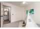 Neutral carpeted bedroom with an open door leading to an ensuite bathroom at 3940 E Heather Ct, Gilbert, AZ 85234