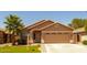 Charming single-story home with a well-maintained lawn and an attached two-car garage at 3940 E Heather Ct, Gilbert, AZ 85234