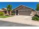 Charming single-story home with a two-car garage, desert landscaping, and a spacious driveway at 3940 E Heather Ct, Gilbert, AZ 85234