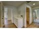 Hallway featuring white cabinets with a quartz countertop, and hardwood floors at 3940 E Heather Ct, Gilbert, AZ 85234