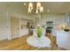 Bright kitchen with white cabinetry, stainless steel appliances, and a dining nook at 3940 E Heather Ct, Gilbert, AZ 85234
