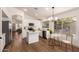 Well-lit kitchen featuring white cabinetry, stainless steel appliances, and breakfast nook at 3940 E Heather Ct, Gilbert, AZ 85234