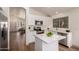 Bright kitchen featuring white cabinets, quartz countertops, and stainless steel appliances at 3940 E Heather Ct, Gilbert, AZ 85234