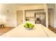 Spacious kitchen with a large island, stainless steel refrigerator, and white cabinets at 3940 E Heather Ct, Gilbert, AZ 85234
