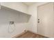 Utility room with laminate wood floors and washer/dryer hook-ups at 3940 E Heather Ct, Gilbert, AZ 85234