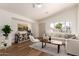 Inviting living room with neutral tones, wood flooring, a vaulted ceiling and comfortable seating at 3940 E Heather Ct, Gilbert, AZ 85234