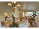 Open-concept living room with a dining area, hardwood floors, and modern decor at 3940 E Heather Ct, Gilbert, AZ 85234