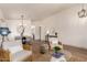 Bright living room with wood floors, neutral decor, and comfortable seating arrangement at 3940 E Heather Ct, Gilbert, AZ 85234