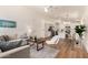 Bright, open-concept living room featuring modern furniture, hardwood floors, and neutral decor at 3940 E Heather Ct, Gilbert, AZ 85234