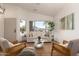 Cozy living space featuring bright natural light, with neutral tones and stylish furnishings at 3940 E Heather Ct, Gilbert, AZ 85234