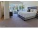 Serene primary bedroom with a bay window and plush carpeting, creating a peaceful retreat at 3940 E Heather Ct, Gilbert, AZ 85234